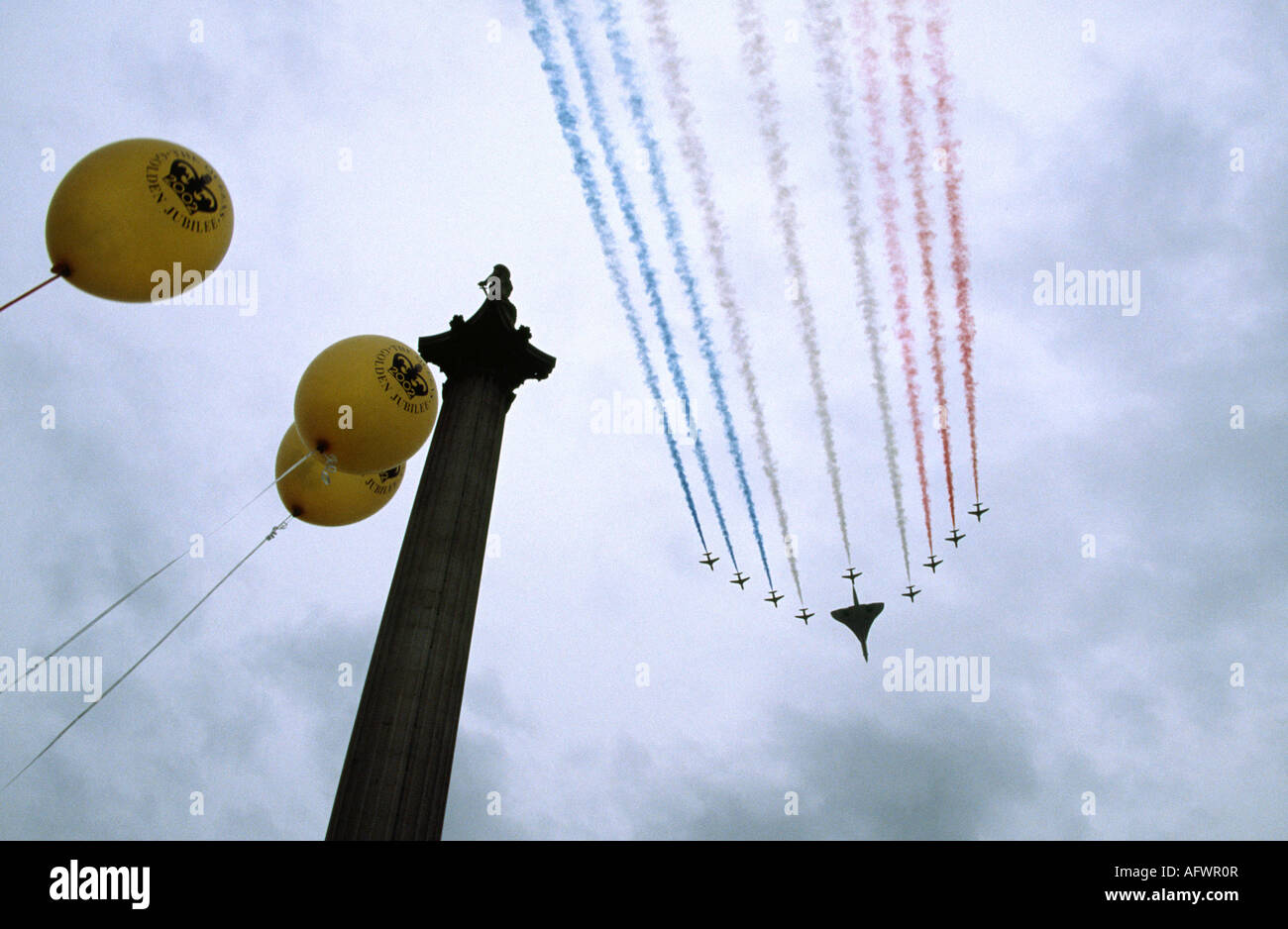 The red arrows and Concorde fly passed Nelson`s column in Trafalgar square during the Golden Jubilee, London, United Kingdom Stock Photo